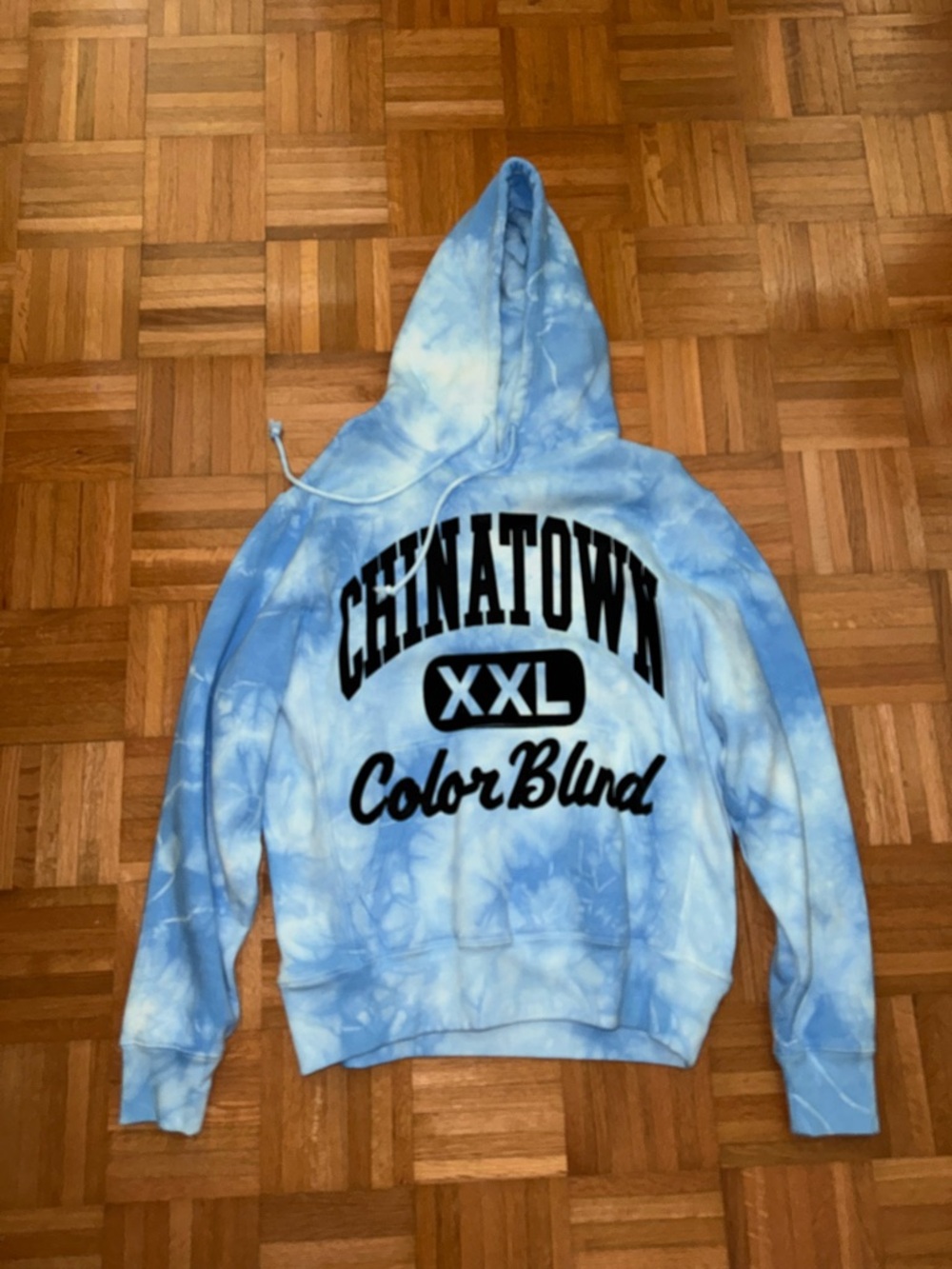 Chinatown Market Light Blue Tie-Dye Hoodie with Bold Logo